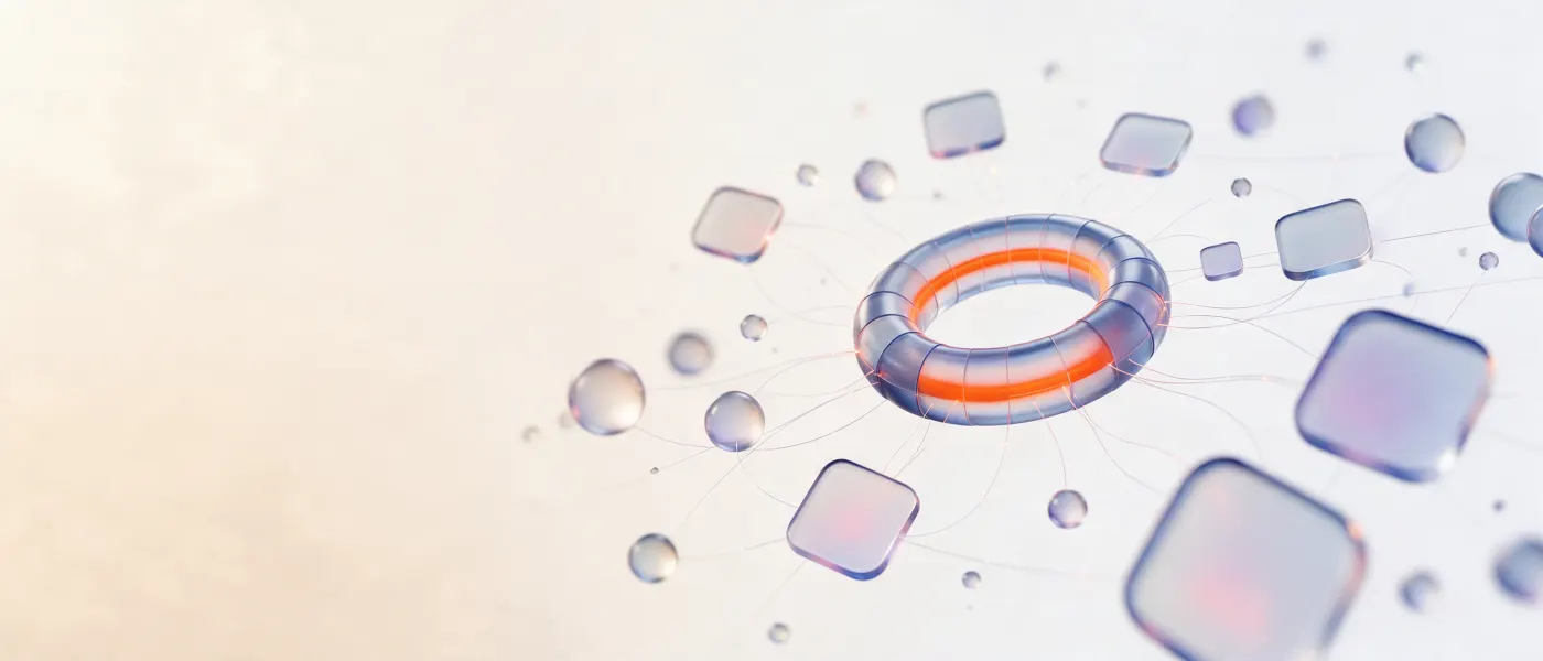 A frosted glass ring with an orange core, joined by fine lines to floating glass tiles and spheres